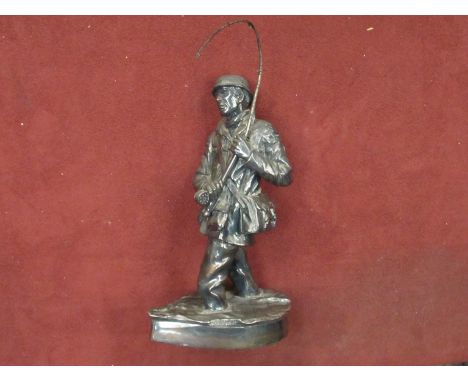 A white metal figure of a fisherman stamped and signed R. Chadwick, 24cm high 