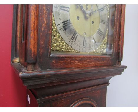 A George III oak longcase clock, the brass broken arch 11.5" dial with silvered chapter ring, calendar aperture and subsidiar