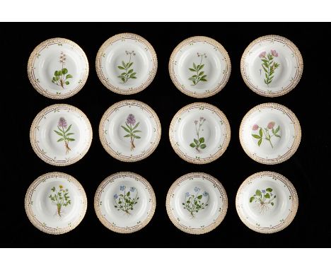 Royal Copenhagen, Denmark. Set of twelve Flora Danica botanical porcelain flat rim soup plates, shape number 20 3545. Each ma