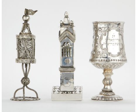 Group of three pieces of Judaic silver including one Kiddish cup and two Havdalah spice towers. The Kiddish cup with a Hebrew