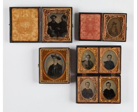 Group of seven 19th century daguerreotype portrait photographs in four cases. One case with four portraits of children; one w