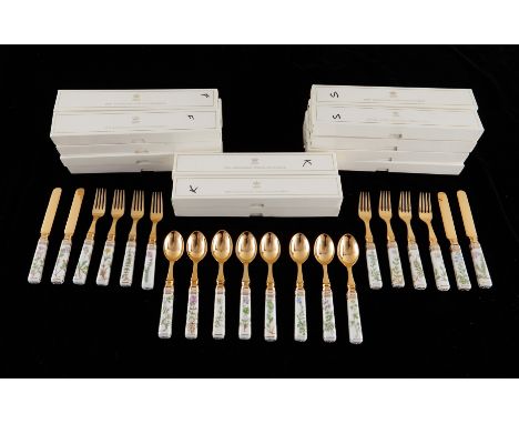 Royal Copenhagen, Denmark. Set of 20 pieces of Flora Danica botanical porcelain flatware, mounted with silver gilt with the m