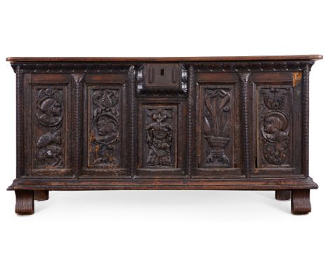 Large Flemish wooden dowry chest. The front panel is made up of five decorative panels, carved with figures, animals, and fac