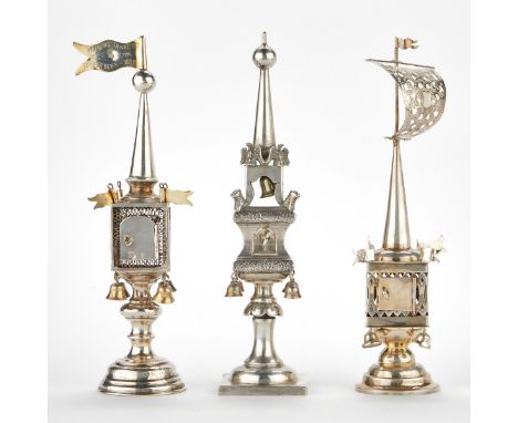 Group of three sterling silver Judaic Havdalah spice towers. All towers feature tall spires rising from the spice boxes, whic