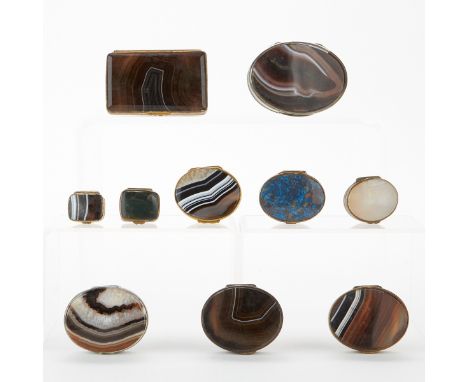 Group of ten snuff and match boxes with black lace agate, seven oval and three rectangular. The boxes are mounted in gilt met