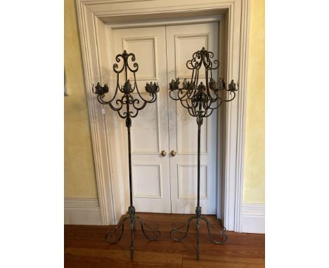 A pair of attractive Victorian style 6 branch wrought iron tall free standing Candelabra, each decorated with leaf design and