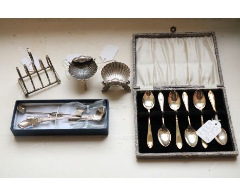 An unusual pair of Sterling silver Shell shaped Salts, each on tri-dolphin legs with two shell spoons, a small Victorian silv