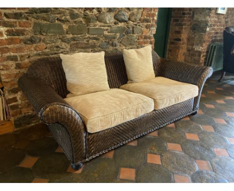 A large two seater basket weave Settee, with two loose cushion seats, 86'' (218cms). (1)