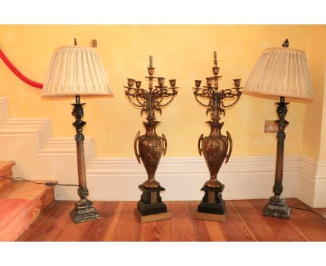 A pair of composition figural column Table Lamps, each surmounted with a female or male bust, with shades, 41'' (104cms); tog