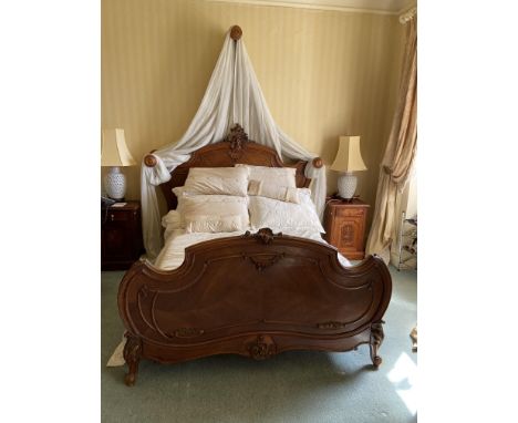 A 4'6'' French walnut cartouche shaped Bed, with bedspread, cushion and drapes. (1) 