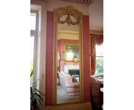 A very attractive painted and parcel gilt Pier or Console Mirror, with ribbon bow crest issuing leaf sprays and supporting fl