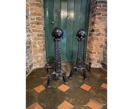 A pair of heavy Gothic Revival cast iron Andirons, each with ball finial on arched front legs, 31'' (78cms). (2) 