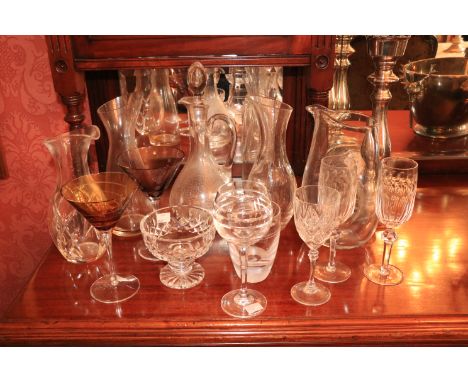 Two similar Waterford crystal John Rocha Wine Carafes, a glass Claret Jug and stopper, a plain glass Carafe and a cutglass st