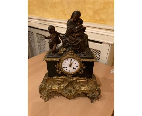 A French gilt metal mounted and polished black marble Mantle Clock, with silk suspension movement and outside count whell str