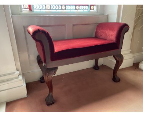 A carved Chippendale style mahogany Window Stool, with cushion seat and padded arm rests, 43'' (109cms). (1) 