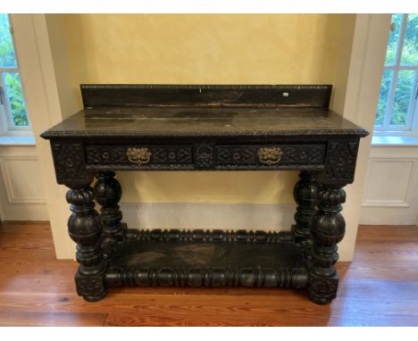 An early 19th Century Cromwellian style blackened oak Buffet, with egg n' dart gallery and edge, over two frieze drawers with