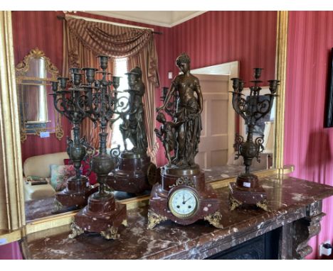 A 19th Century French Clock Garniture, the clock modelled with a large spelter figure of a mother and child on ormolu mounted