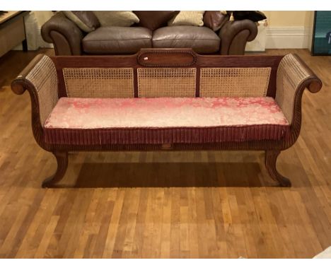 A modern Regency style mahogany Bergeré Settee, with basket work back and side panels and scroll ends above a cushion seat on