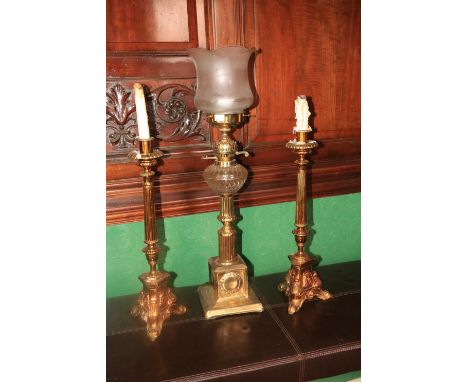 An attractive brass Table Lamp, with cutglass bowl over a turned and reeded pillar with square base, decorated pink glass sha