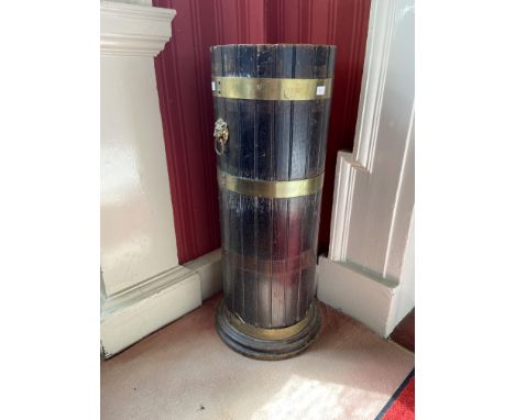 A cylindrical brass bound oak Stick &amp; Umbrella Stand, with lion mask handles, 31'' (78cms). (1) 