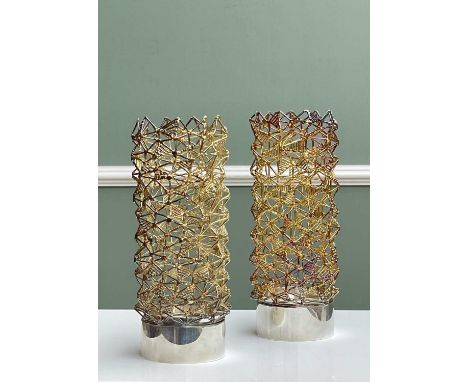 ‡ PAIR STUART DEVLIN SILVER &amp; SILVER-GILT CANDLEHOLDERS, London 1968, each with removable cylindrical cage work shade on 