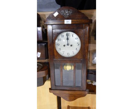 A carved walnut mantel clock with striking movement, a 20th century oak wall clock,  a modern Acctim quartz mantel timepiece,