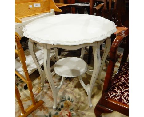 A white painted piecrust top table on cabriole legs united by under-shelf, 89cm diameter 