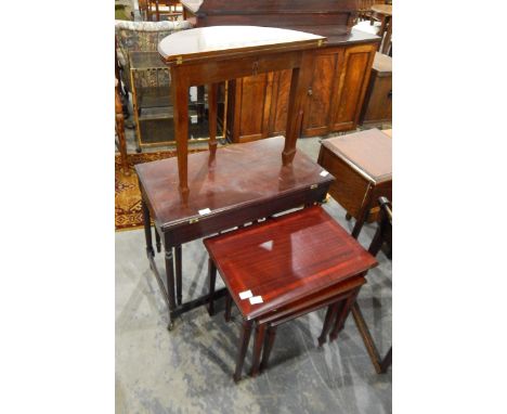 A demi-lune fold-over card table with baise lined top and on tapering square supports with spade feet and a nest of three mah