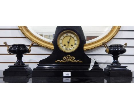 A Victorian black slate clock garniture, the drum-shaped movement in waisted case, on plinth base, with gilt metal ribbon dec