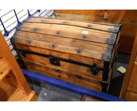 A pine trunk with domed top, wooden splat and button decoration, 77cm wide 