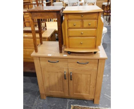 A modern side cabinet with two short drawers and cupboard under, on square block supports, an oak small side table on square 