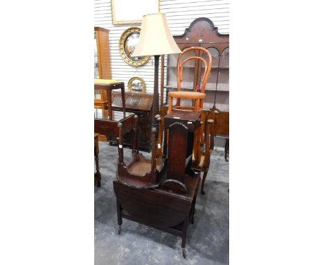 An oak drop-leaf tea trolley, a cane seated bentwood chair, three cane seated dressing stools, a mahogany standard lamp with 