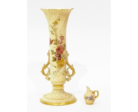 A Royal Worcester miniature jug painted with flowers on an ivory ground, 4cm high and a Royal Worcester two-handled vase of f