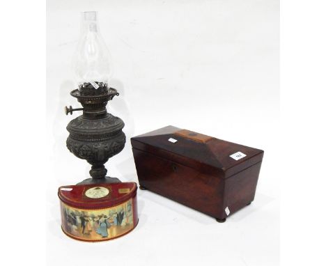 A 19th century mahogany sarcophagus-shaped tea caddy, an oil lamp with glass funnel and a tin of loose postage stamps (3) 