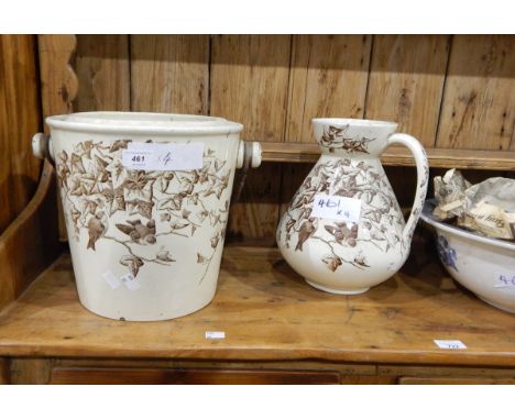 A ewer and wash bowl with drainer, cream ground, brown transfer pattern of birds and ivy "Ivy Bower", a large Willow pattern 
