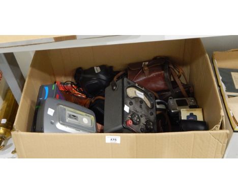 Various camera equipment to include early digital cameras, the Universal avometer model no.7, a Kodak Easyshare printer dock,