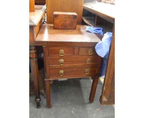 An early twentieth century mahogany folding envelope top card table, lined with baize, with two short and two long drawers be