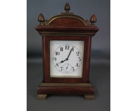A good guality mahogany bracket style mantel clock of small proportions 20 cm tall