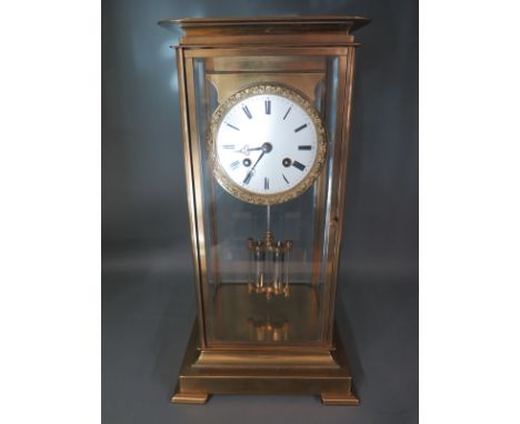 A 19th century French four glass brass lacquered mantle clock with a 9cm enamel dial signed LEROY A PARIS striking on a bell,