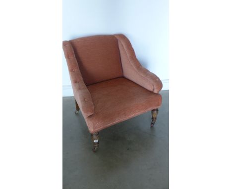 A Victorian oak framed Ladies chair with button back fabric upholstery on turned legs and castors 