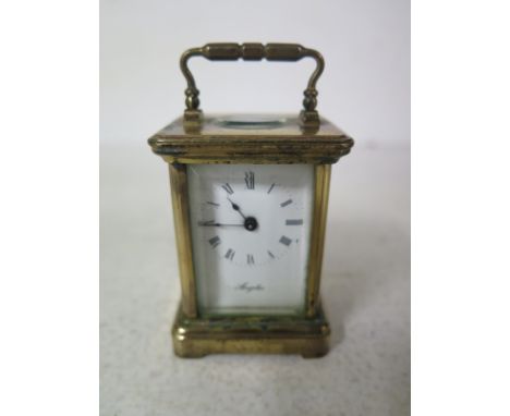 A miniature Angelus L'Epee French carriage clock - 45cm x 4cm x 6cm 
Condition report: Pin missing from bottom of back door 