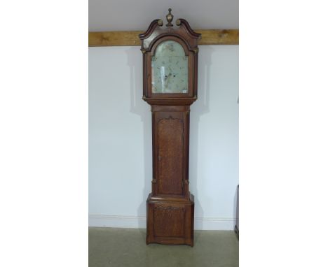 An oak and mahogany eight day longcase clock with a 14" arched painted dial having secondary and calendar dials signed C. Bla