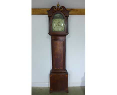 An oak and mahogany eight day longcase clock with a 12" arched painted convex dial signed John Hall,Sleaford with weights and