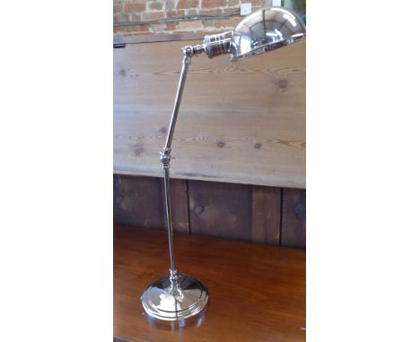 A nickel plated desk lamp with three hinges - Height 8cm 
Condition report: As new