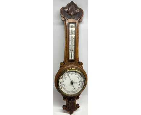 Edwardian carved oak Aneroid barometer and thermometer, H90cmPOA  https://www.bradleys.ltd/quotation-request-form