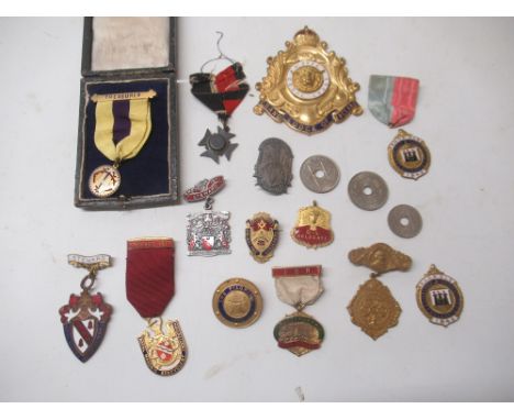Yellow metal and enamel Cecil Lodge Masonic badge, a boxed Treasurer Masonic medal, and a collection of similar medals and ba