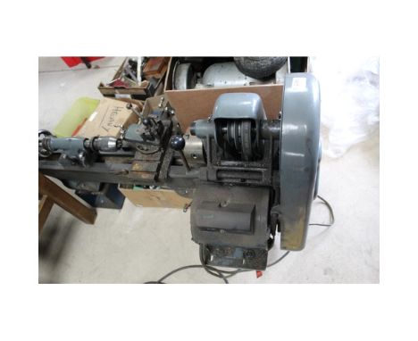 Myford ML7 metal working lathe with operating instructions and collection of accessories including a large quantity of turnin