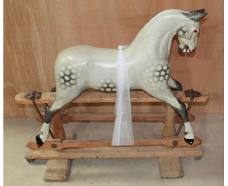 Small rocking horse by Ayres of London c1890. On stand, paint work complete, lacking mane, tail and tack. Height to crest 87c