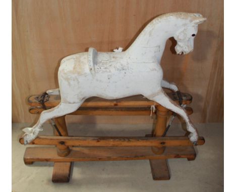 Medium size Lines rocking horse. Restoration project stripped down to wood with some areas filled. Complete with glass eyes a