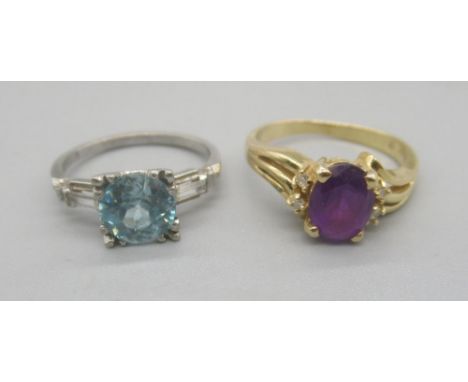 14ct yellow gold ring set with oval cut purple stone, stamped 585, size L, 3.50g and a 10k white gold ring set with blue ston